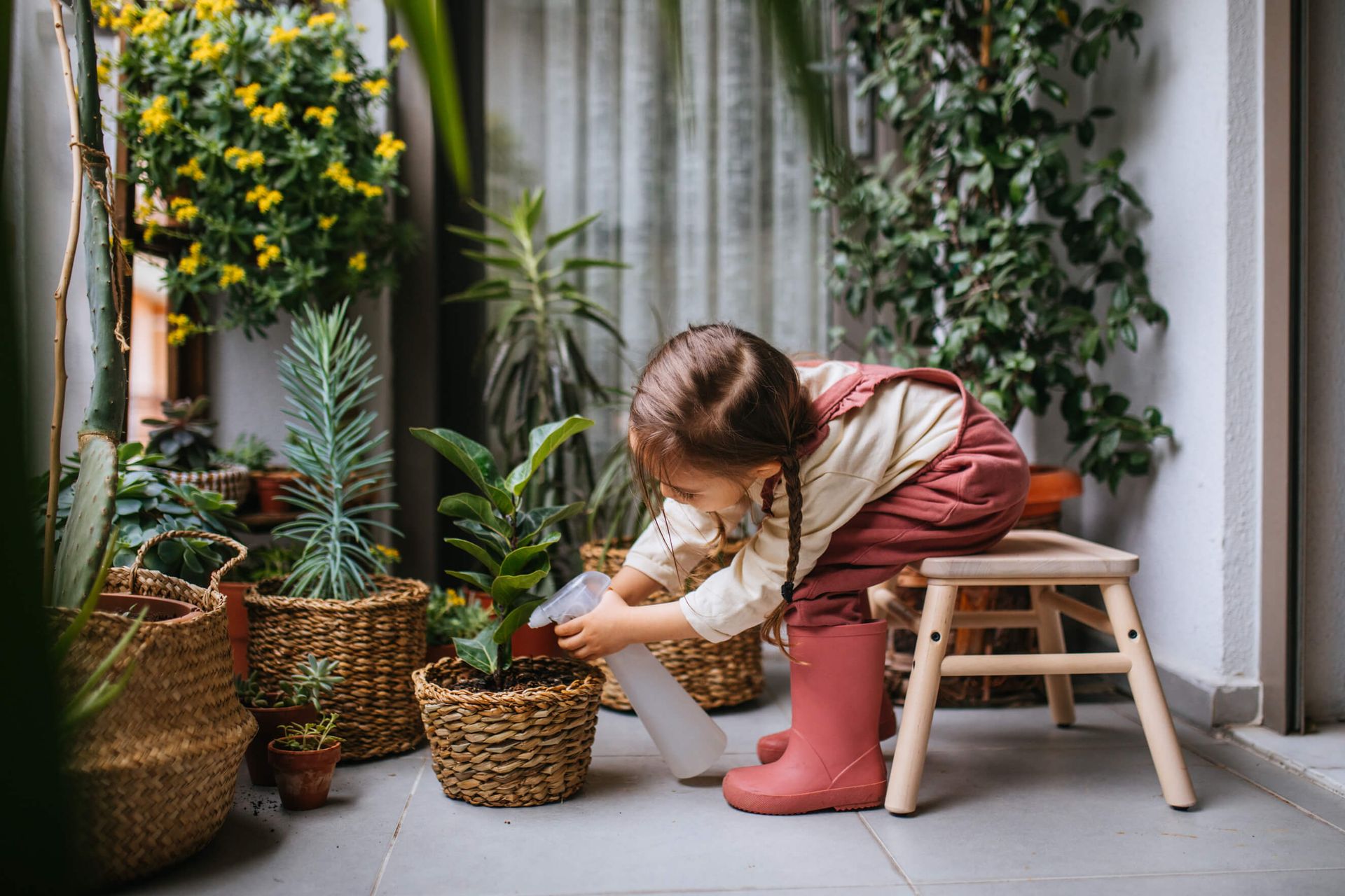 A child watering a plant